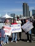 Familes cheer and welcome the Midway home.