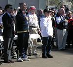 Everyone stands to pledge allegiance to the flag.