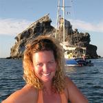 Cherie with the guano-covered volcanic rocks of Isla Isabela in the background.