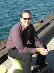 Greg takes a rest on the tree-lined boardwalk.