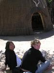 Renee and Caitlyn near a Swazi hut.