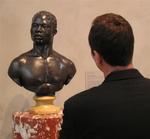 Greg admires "Bust of a Man" by Francis Harwood.