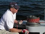 Checking the sail's trim.