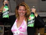 Cherie celebrates "BVI Yacht Charters 1" win on Day 2 American Style--with "super-sized" bottles of Heineken!
