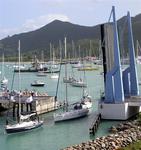 Sailboats line up for the bridge opening.