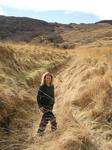 Cherie walking through fields of grain.