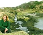 Cherie by a stream.