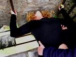 Pucker up.  Cherie kissing the Blarney Stone.  You have to bend over backwards and hold on to kiss the famous stone.