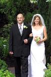 Steve walks his daughter (Kristi) down the aisle.