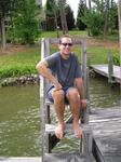 Greg watches from the dock.  He's sitting at the dock of the bay, wasting time.