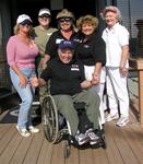 Duncan, the Founder of Access to Sailing, surrounded by ladies.