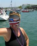 Who is that masked woman?  It might be Cherie at ALYC's Old Glory Boat Parade.  Here are photos of 4th of July, Newport Beach style.