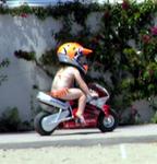 Which weighs more, the kid or the helmet?