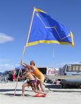 Cherie and Jean raising "Camp Cassiopeia's" battle-flag. *Photo by Rennie.