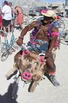 Doesn't every cowboy ride a pig motorcycle?