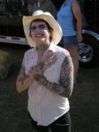 Big smiles for cowboy hats and tatoos.