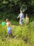 Kids catching frogs.