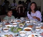 Tonya and Tyler pretending to eat another huge feast.