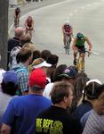 People cheer as the athletes race by.