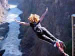 Go take a flying leap!  Cherie jumping off a bridge near Victoria Falls.