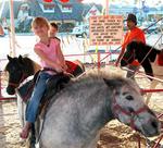 Ellie's all smiles on the pony ride.