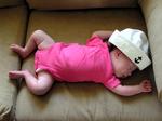 2-week-old Charlotte sleeping with a sailor hat.