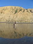 The sand acts like a wet mirror.  