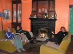 After a cold day, Lindsay, Kat and Cherie cuddle up by the fire of an old monastery.