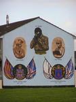 Many houses are painted with political murals.