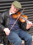 A side-walk fiddler.