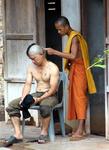 A man prepares to enter the monastery.