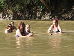 Relaxing in cold water with a warm beer.