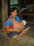 Lahu man swaddles his baby. *Photo by Hannah.