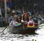 Exploring the floating market. *Photo by Yorham.