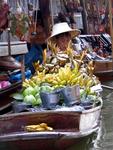Boats loaded with fruits that look bad, but taste good.