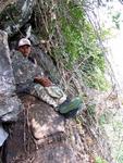 One of our Thai guides rests between the rocks.