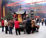 Burning incense at the Jade Buddha temple.
