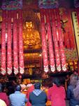 Everyone waits while the monks arrive.