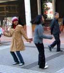 Ladies dancing in the park.