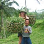 Cherie helps a boy lift the cattle-food. *Photo by Margaret.