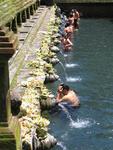 The Balinese stop under each spout to bathe.