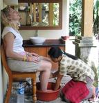 At the end of a long day, Margaret relaxes with a foot-bath.