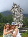 Margaret and Cherie next to an angry statue in Bedugal's botanical gardens.