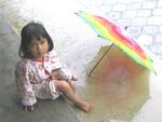 Little Balinese girl with an umbrella.