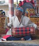 How do you play a drum with a feather?