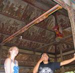 Ketut explains the meaning of the paintings.