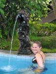 After a long hike, Hannah relaxes in the volcanic spring water.