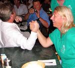 Carol gets challenged to an arm wrestling contest.