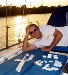 Greg getting beaten (again!) during dominoes at sunset.