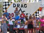 The Conch Republic Drag Queens gather near the stage.